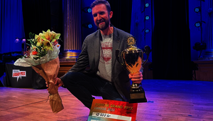 Matthew Tompkins with his first prize trophy and winner's check.