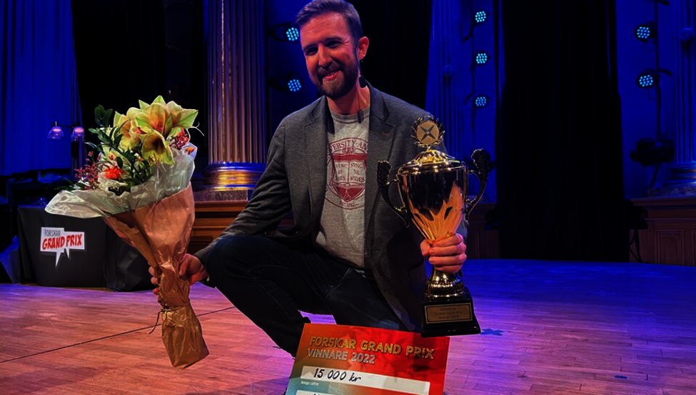 Matthew Tompkins with his first prize trophy and winner's check.